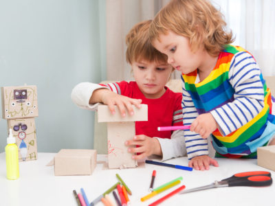 two little children playing together in creativity